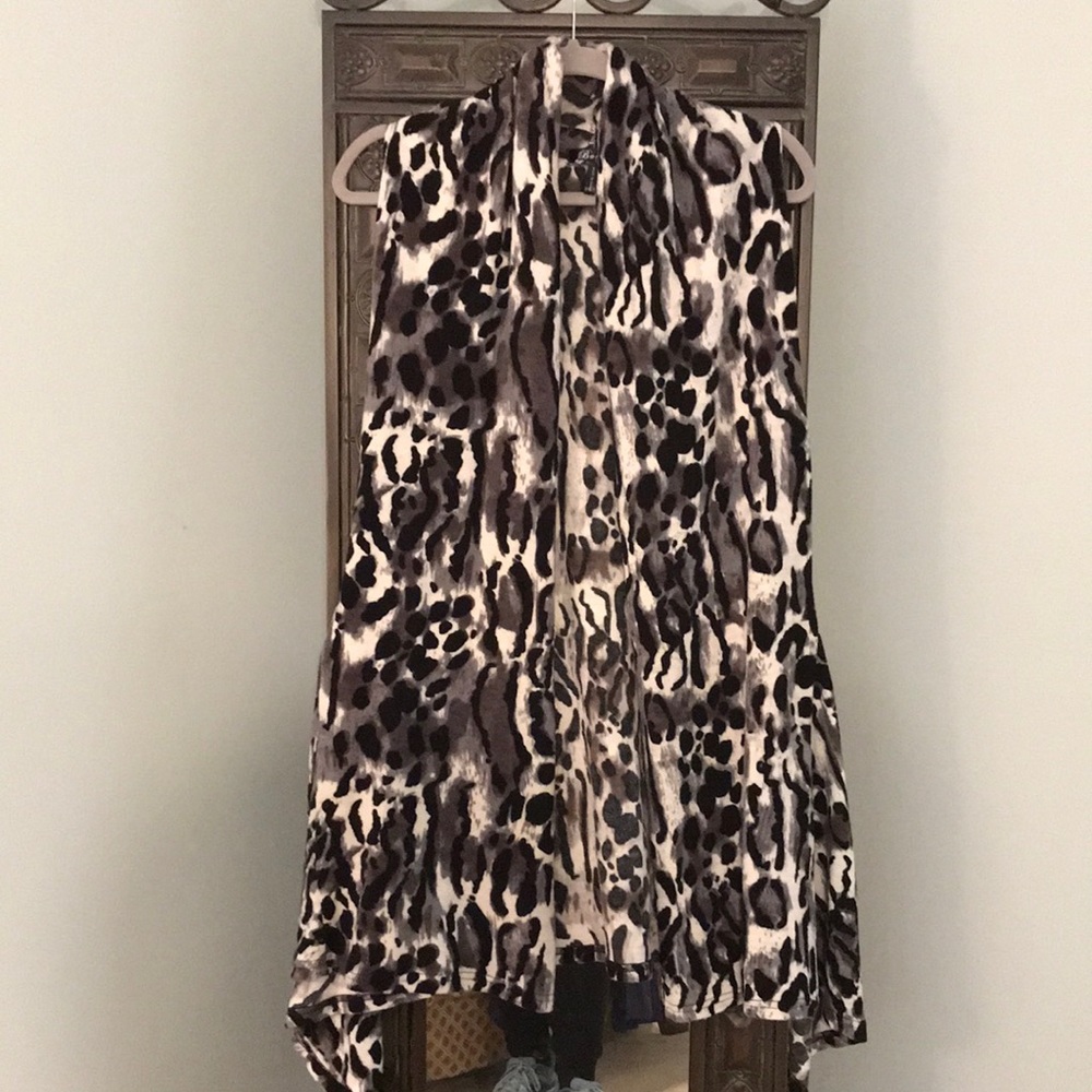 Winter vest, black and white animal print. Asymmetrical hem.